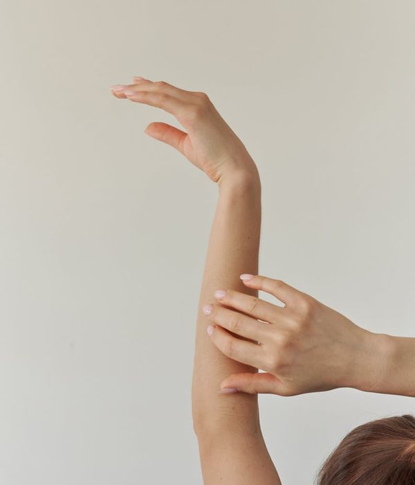 Woman in a graceful yoga pose with spring mint light accents.